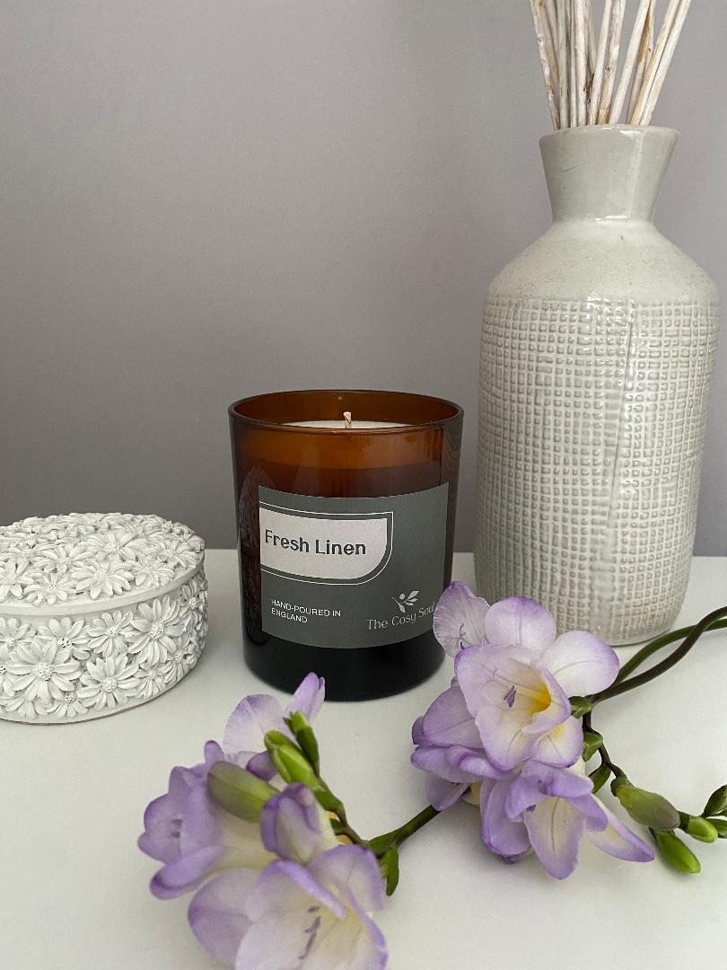 The Cosy Soul Fresh Linen candle with freesia flowers and decorative ornaments