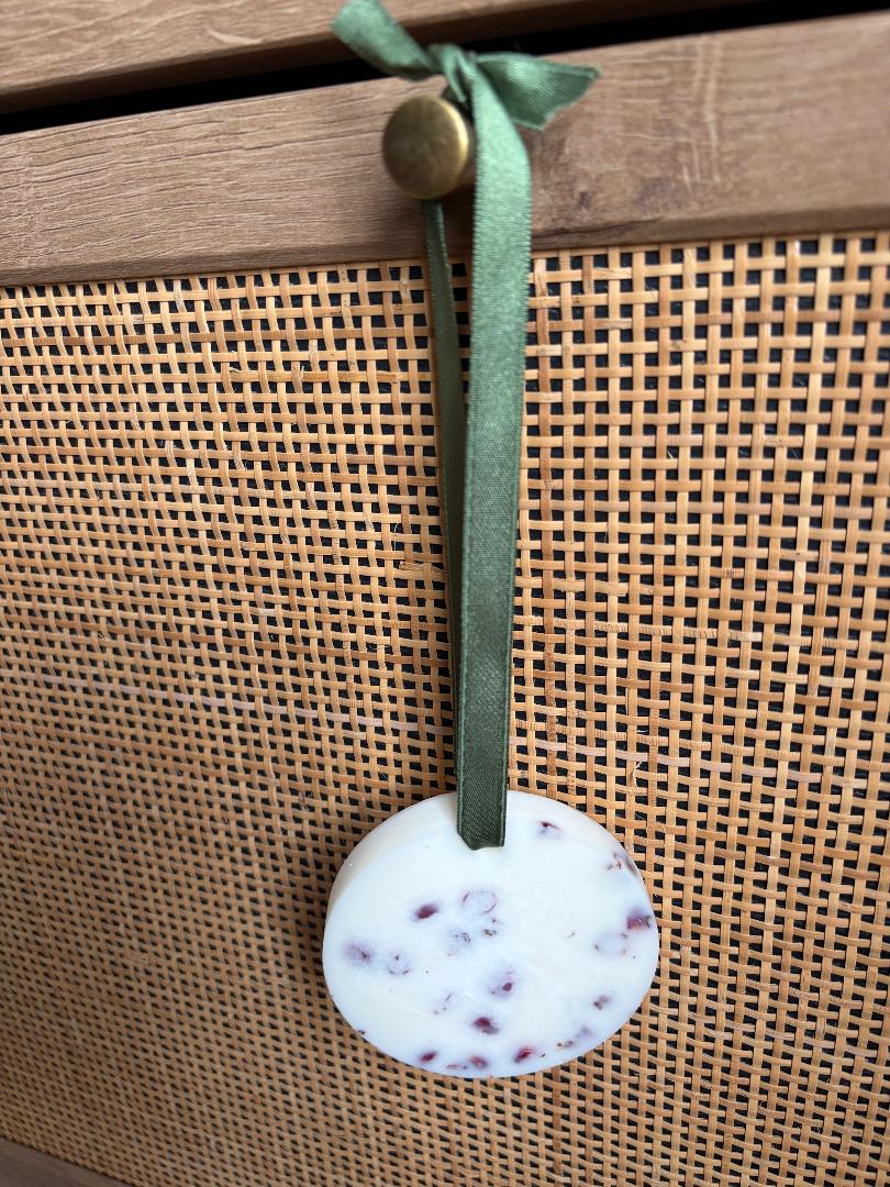 Hanging Wax Melt on green ribbon and wooden background