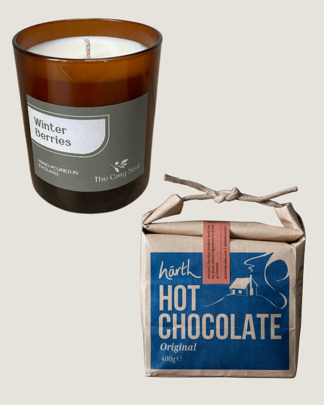 The Cosy Soul Candle labelled 'Winter Berries' next to a box of Harth Hot Chocolate